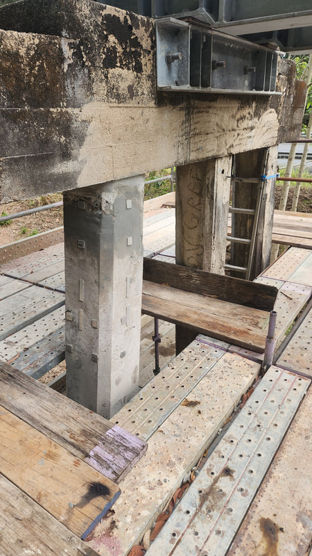 Repair of concrete bridge pier using crack injection and epoxy binder