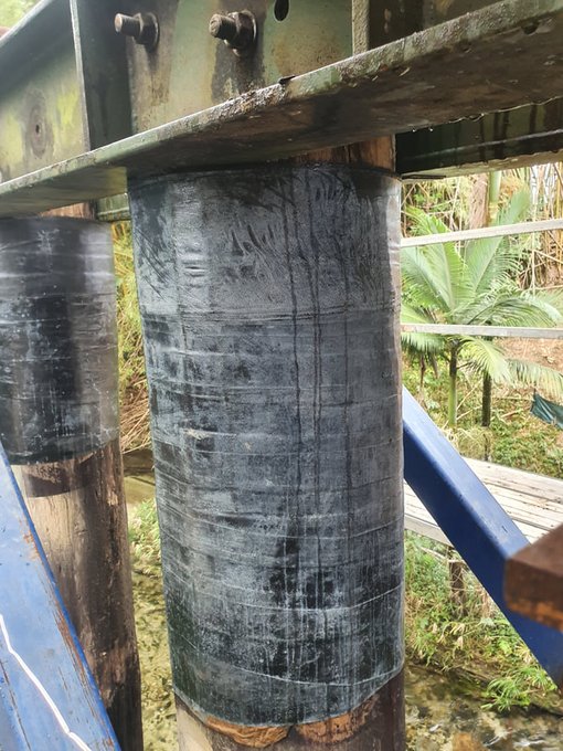 Composite fibre repair for pile strengthening